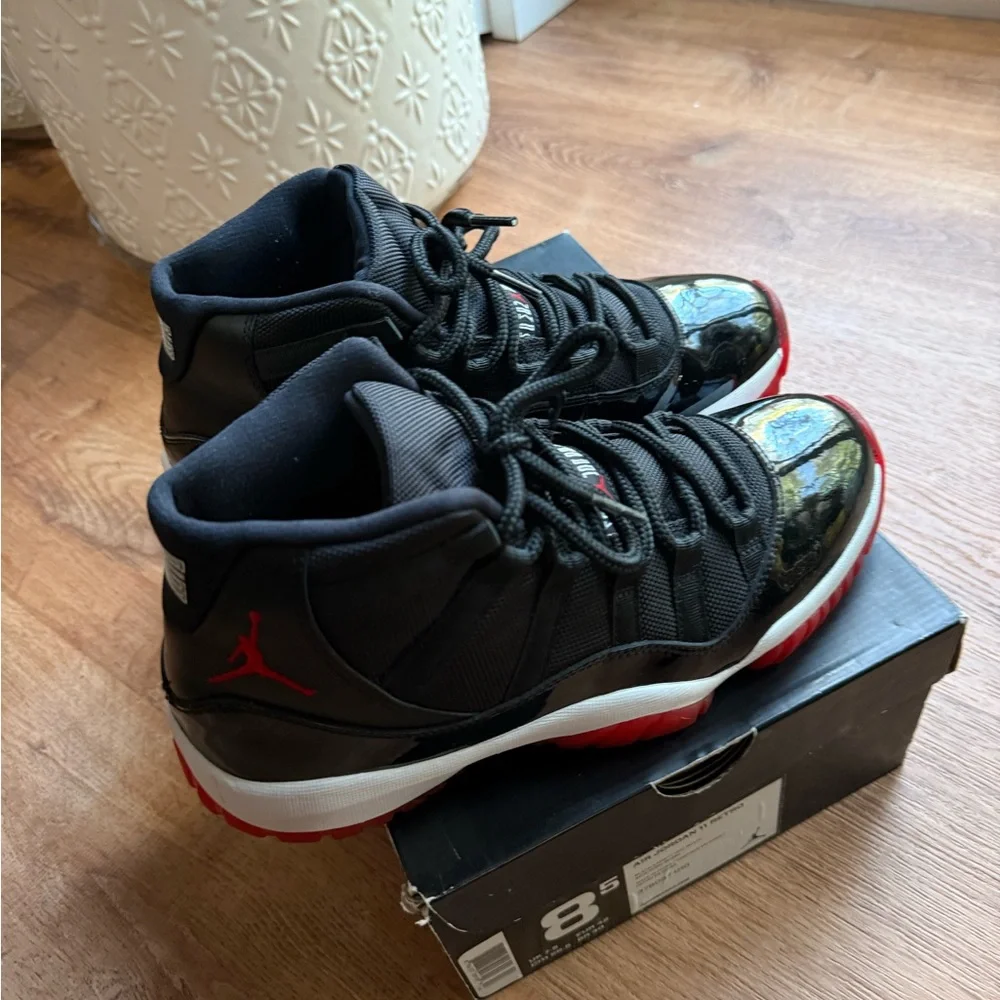 Air Jordan 11 Bred Black and Red High-Top Basketball Sneakers